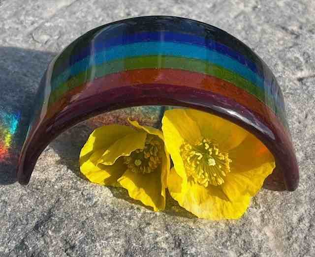 Colourful kiln-formed fused glass dish in blues, purples and gold